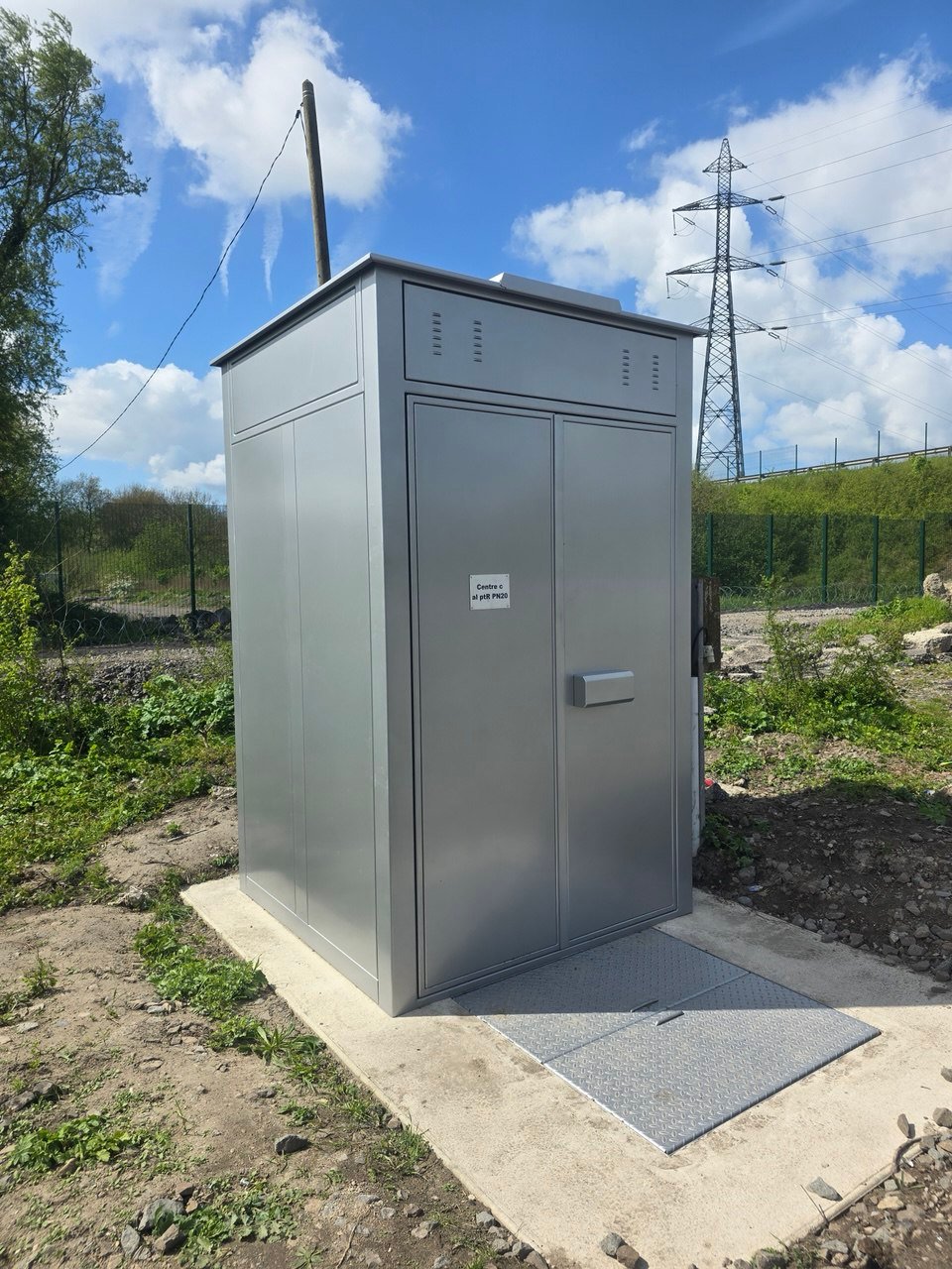 SafeBox AV enclosure on its slab beside the running line