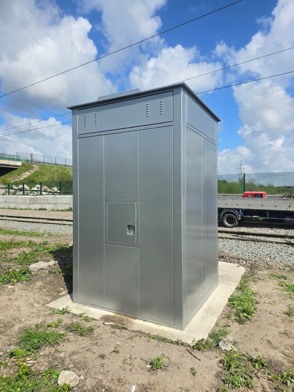 SafeBox AV enclosure beside a signal gantry