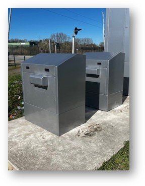 Two SafeBox AVAC battery shelters in service on a concrete base