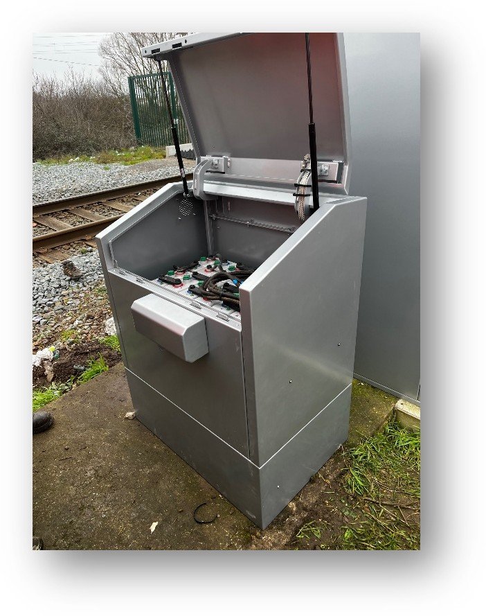 SafeBox AVAC shelter with the lid raised on gas struts over the battery compartment
