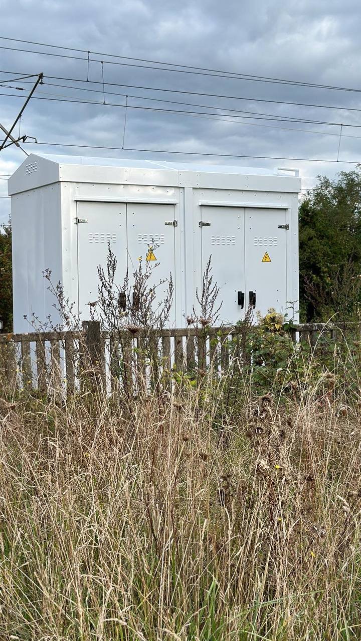 SafeBox RT cabinet with the door open on the equipment rack